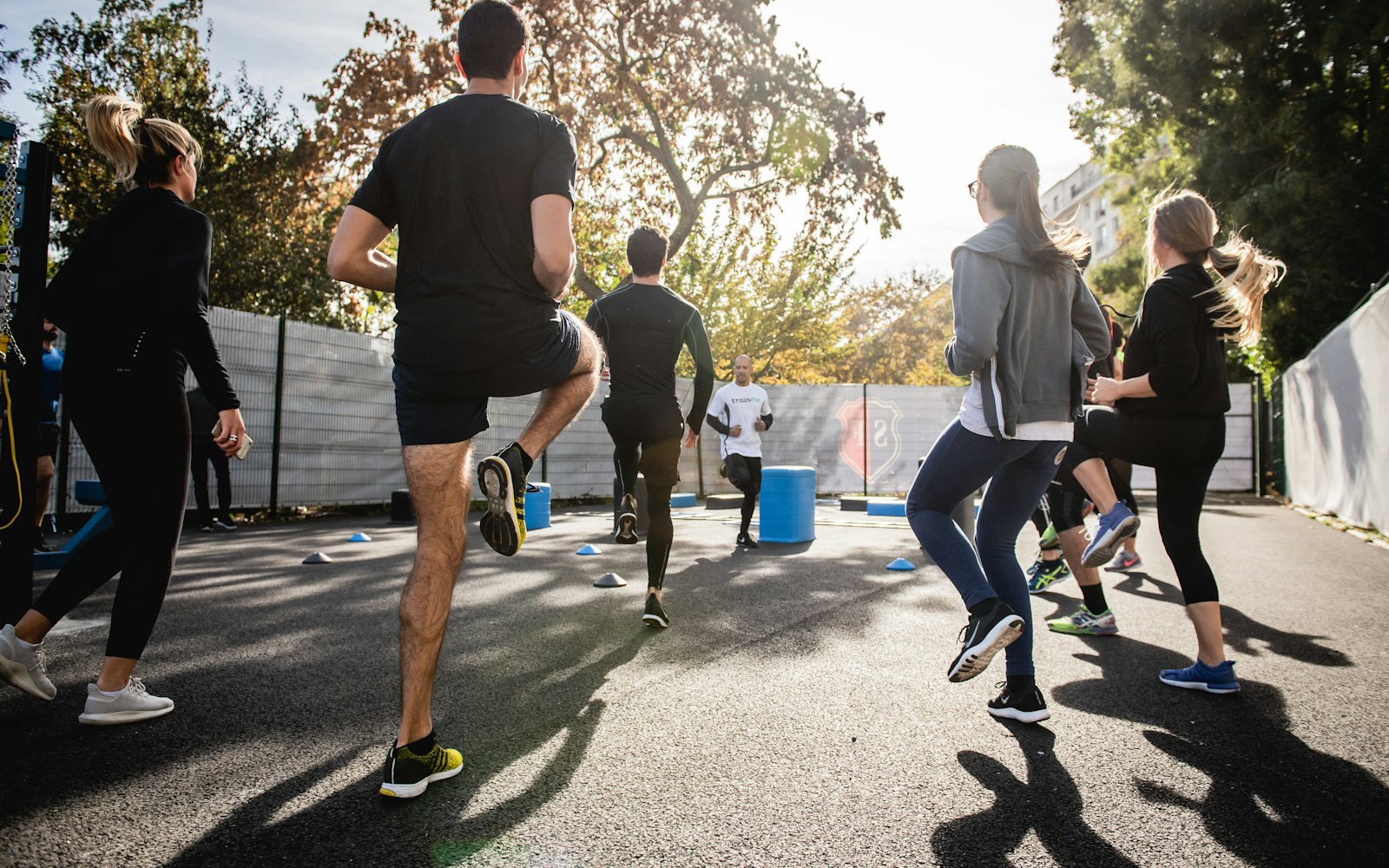 Group warms up together during an outdoor fitness session