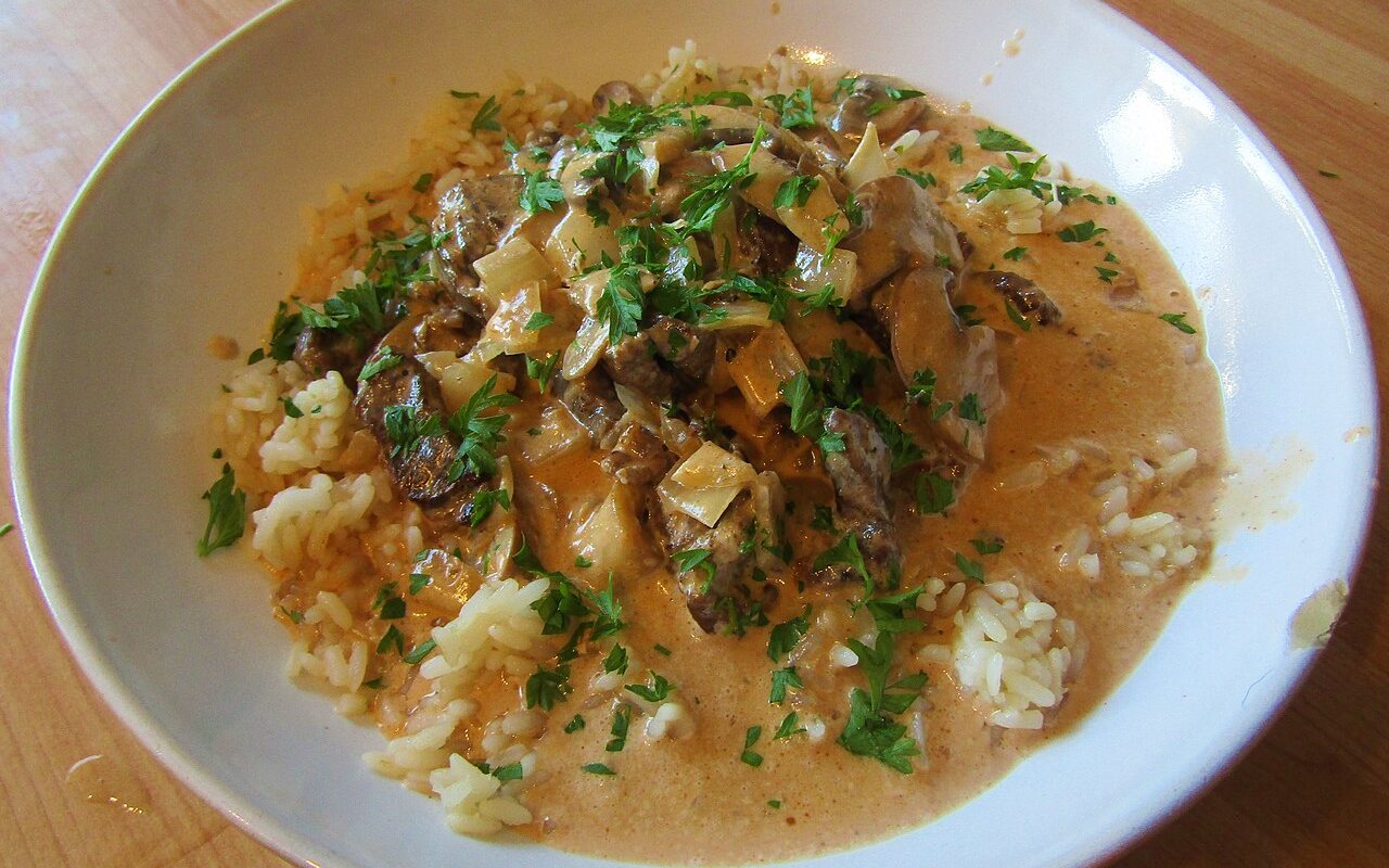 Creamy beef stroganoff with mushrooms, onions, and green pepper