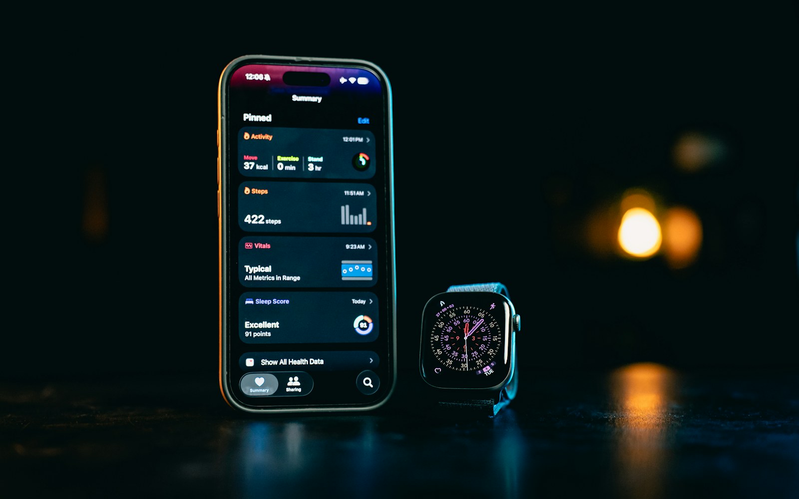 Smartphone and smartwatch displaying activity, sleep, and health data