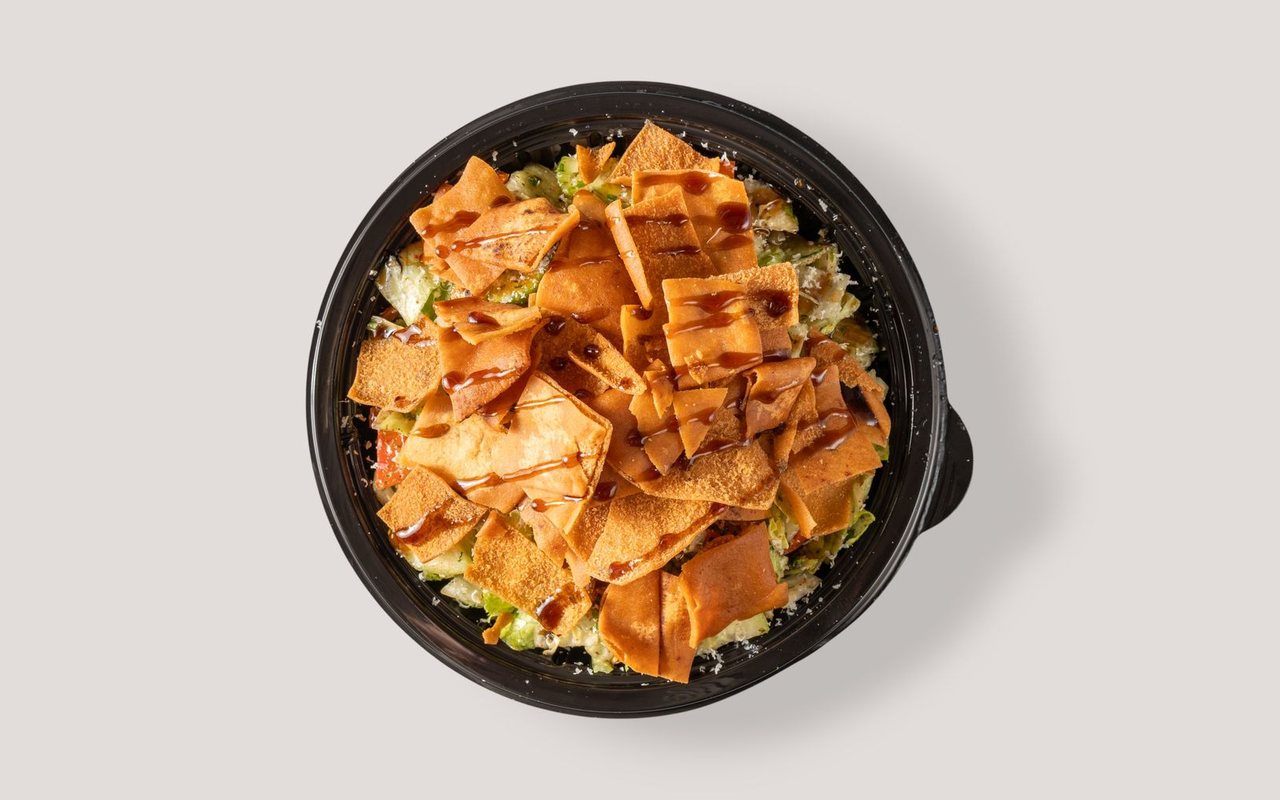 Chopped fattoush salad topped with crisp triangular lavash pieces