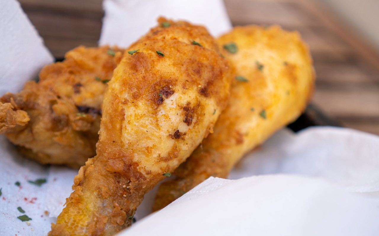 Golden fried chicken drumsticks with a crunchy corn-chip coating
