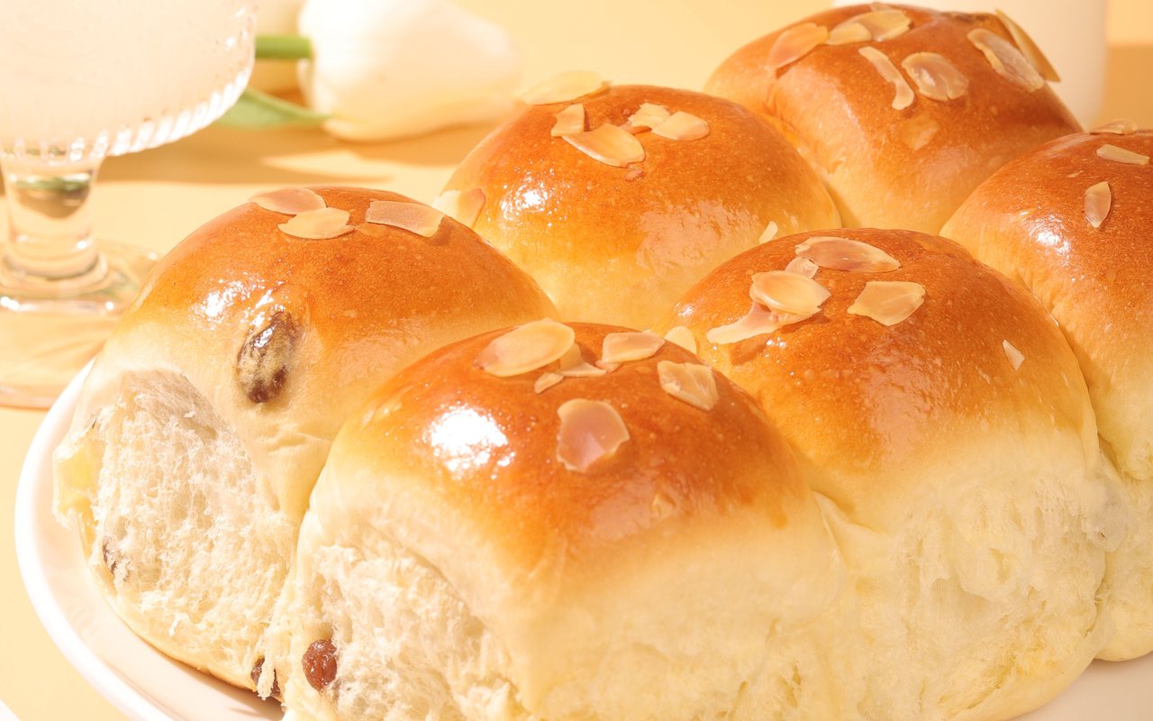Golden brioche rolls baked in individual muffin cups