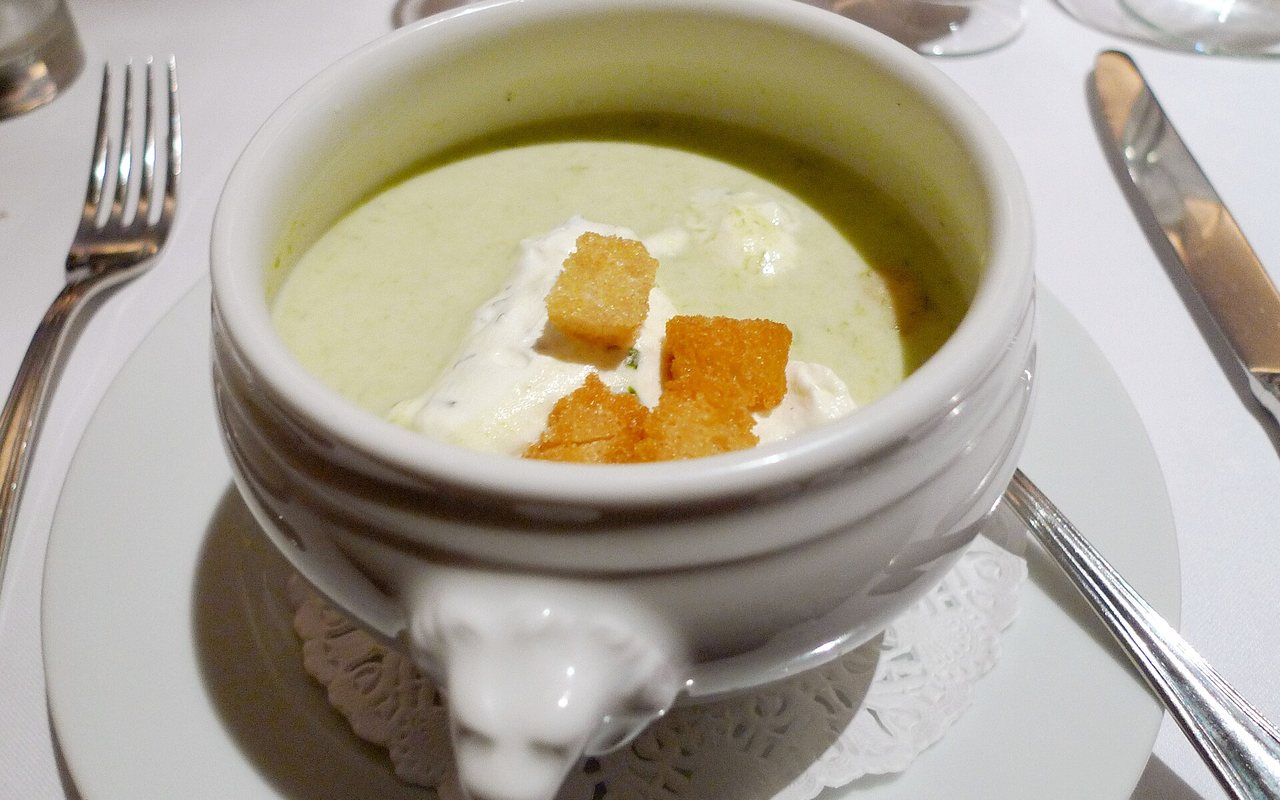 Creamy potato soup topped with chopped parsley