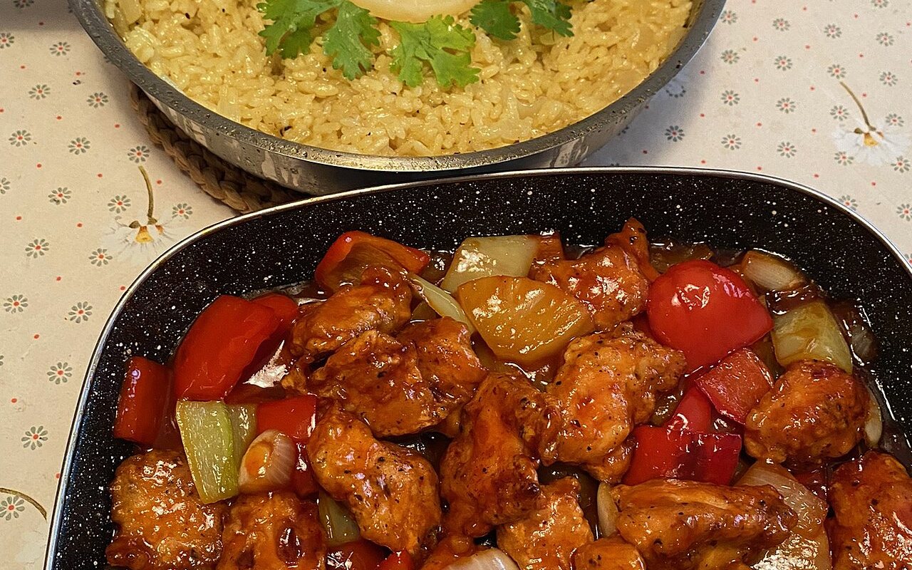 Sweet-and-sour chicken with pineapple, green pepper, carrot, and scallions