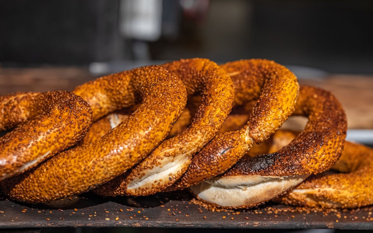 Twisted Turkish simit rings coated in toasted sesame seeds