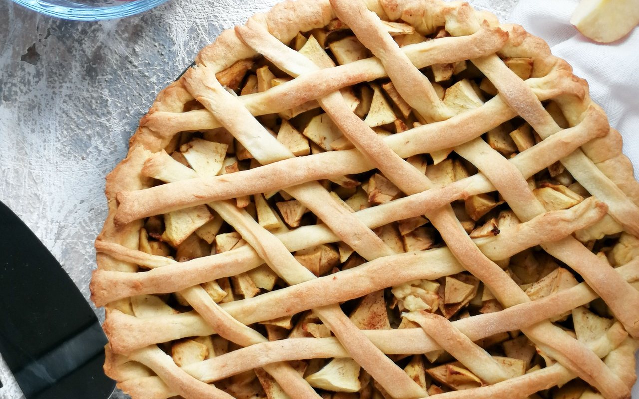 Lattice-topped apple tart in a round pan