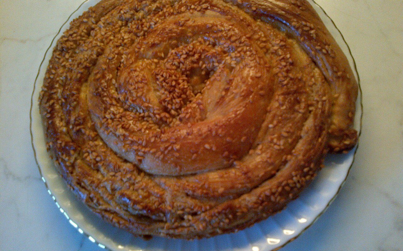 Round coiled tahinli çörek pastries topped with sesame seeds