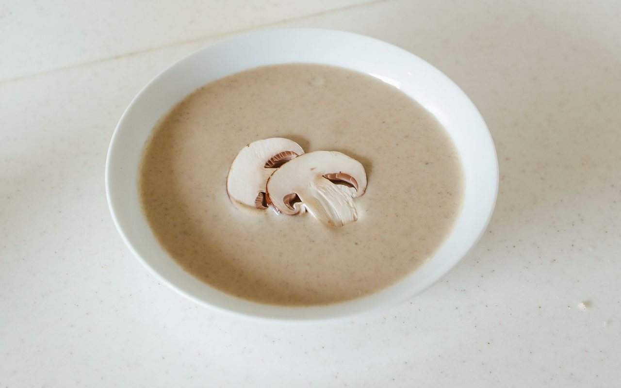 Creamy mushroom soup with sliced mushrooms and red pepper